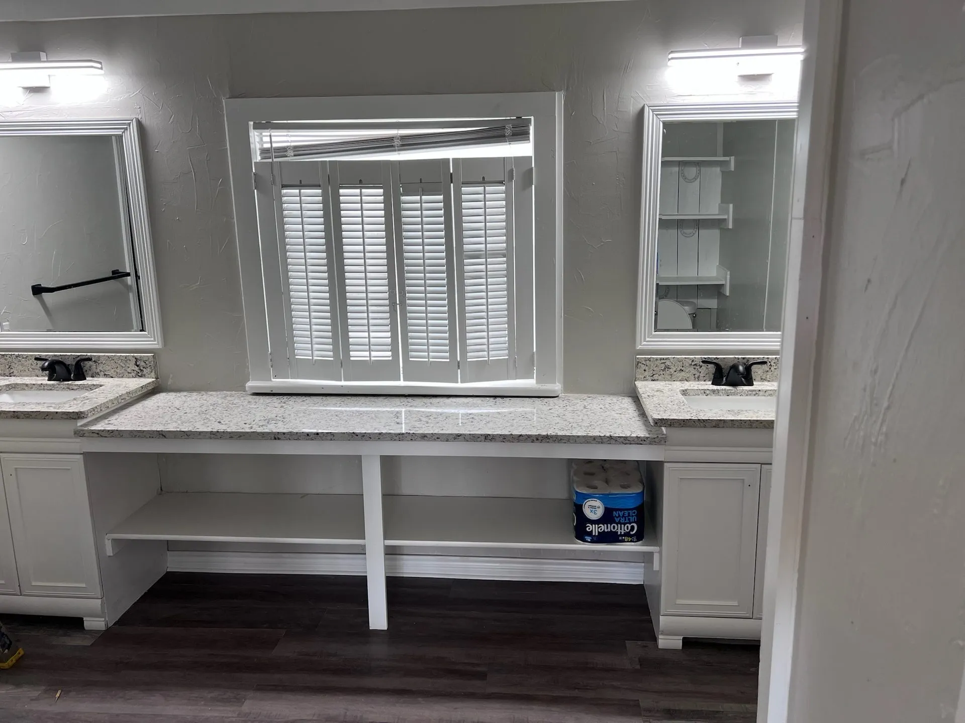 Master bath dual vanity with granite, plantation shutters, and framed mirrors