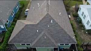 Before → after: Class 3 impact-resistant shingles on a Central Austin home.