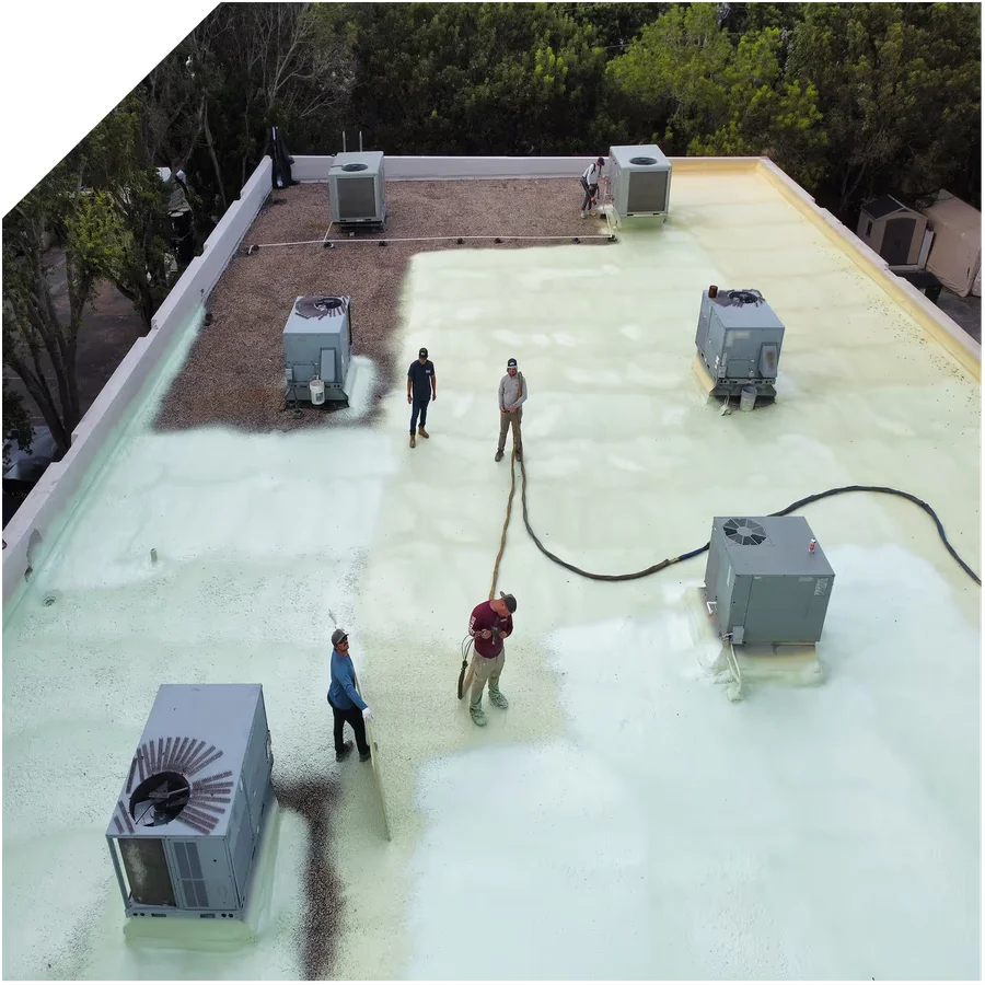 a crew performing a commercial roof coating job