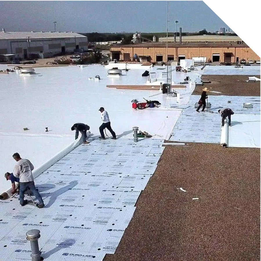 a crew performing a commercial roof recover job