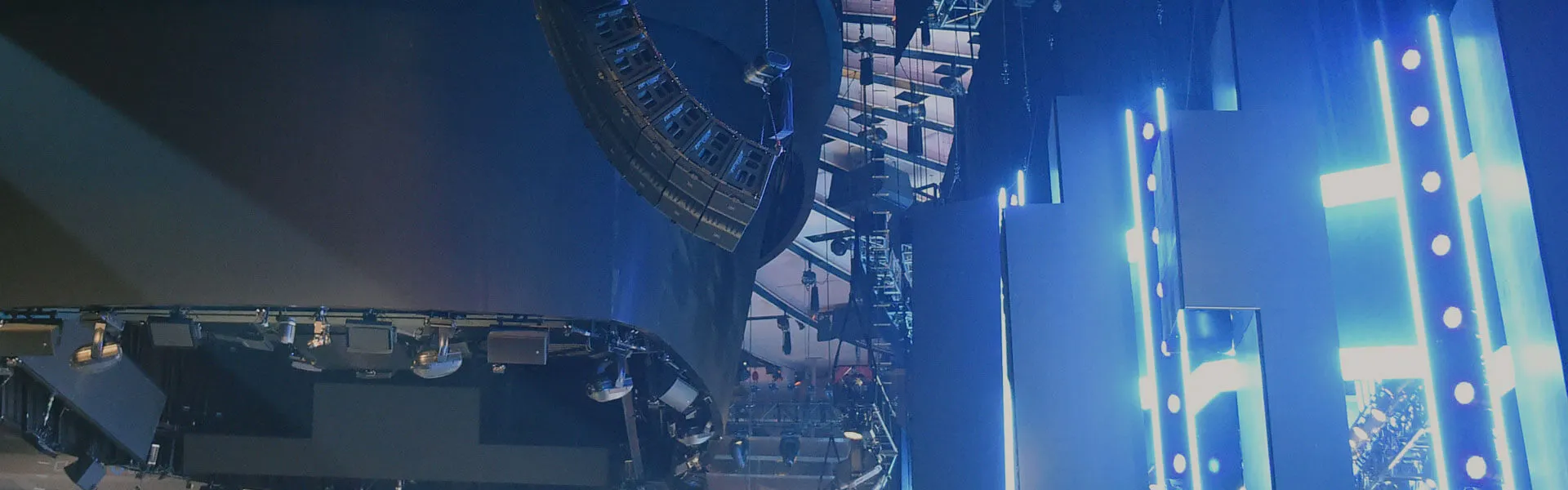 A line array speaker system flown above an AVSS stage