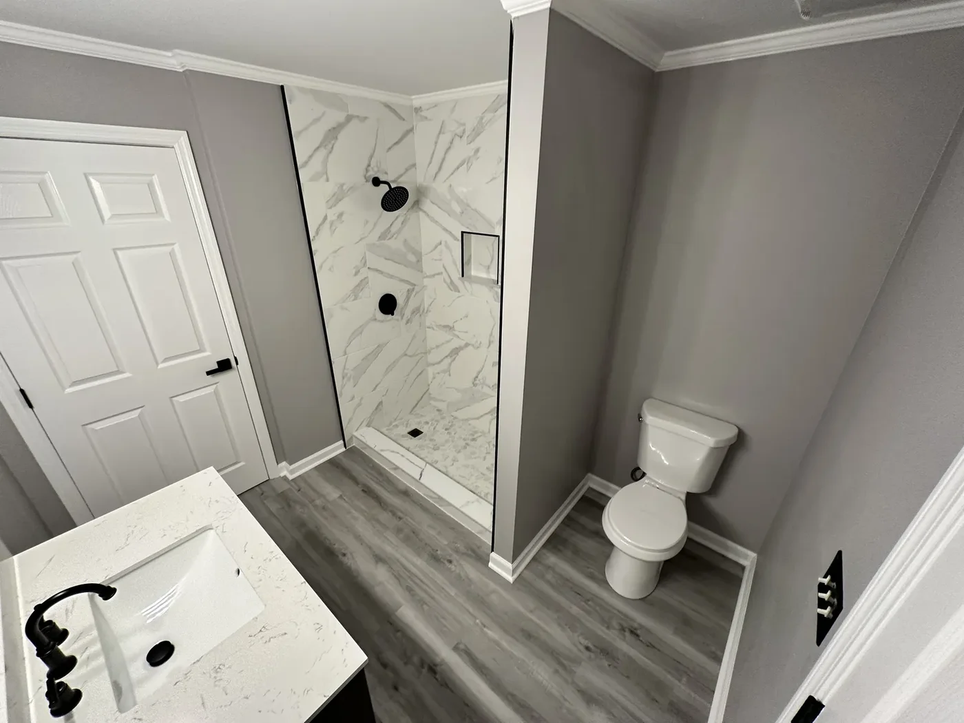Bathroom remodel with a marble-tile walk-in shower