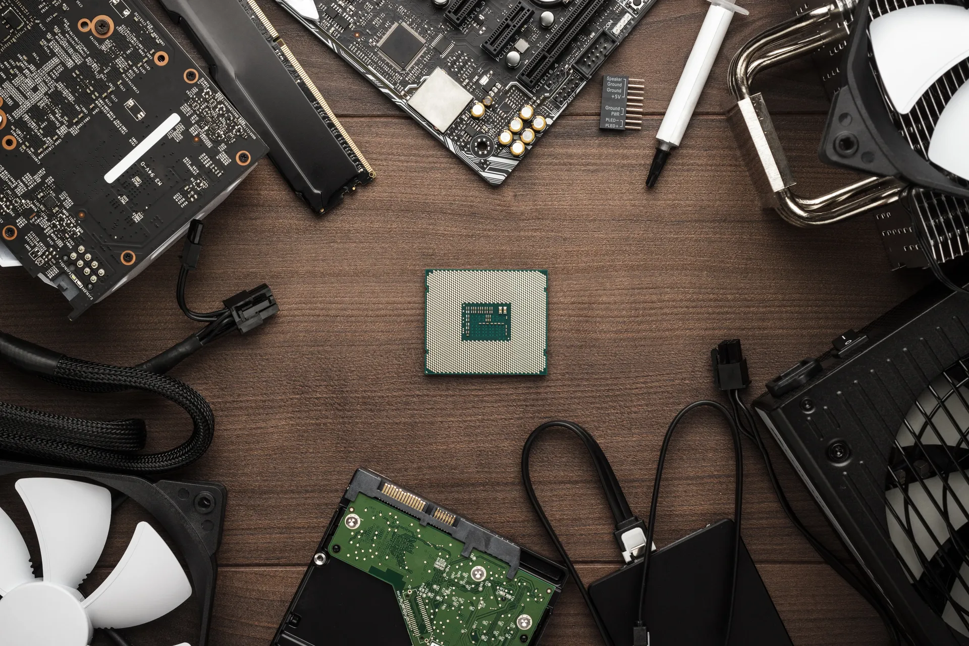 A CPU and assorted computer components laid out on a table