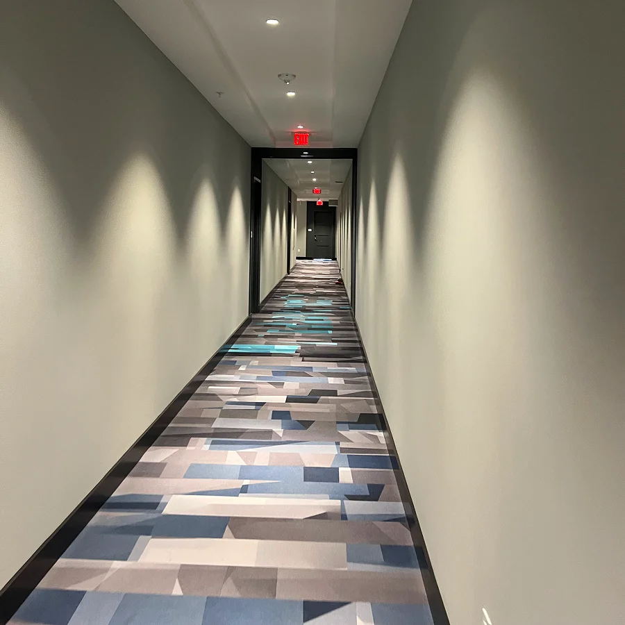 freshly painted tan walls in a hotel hallway
