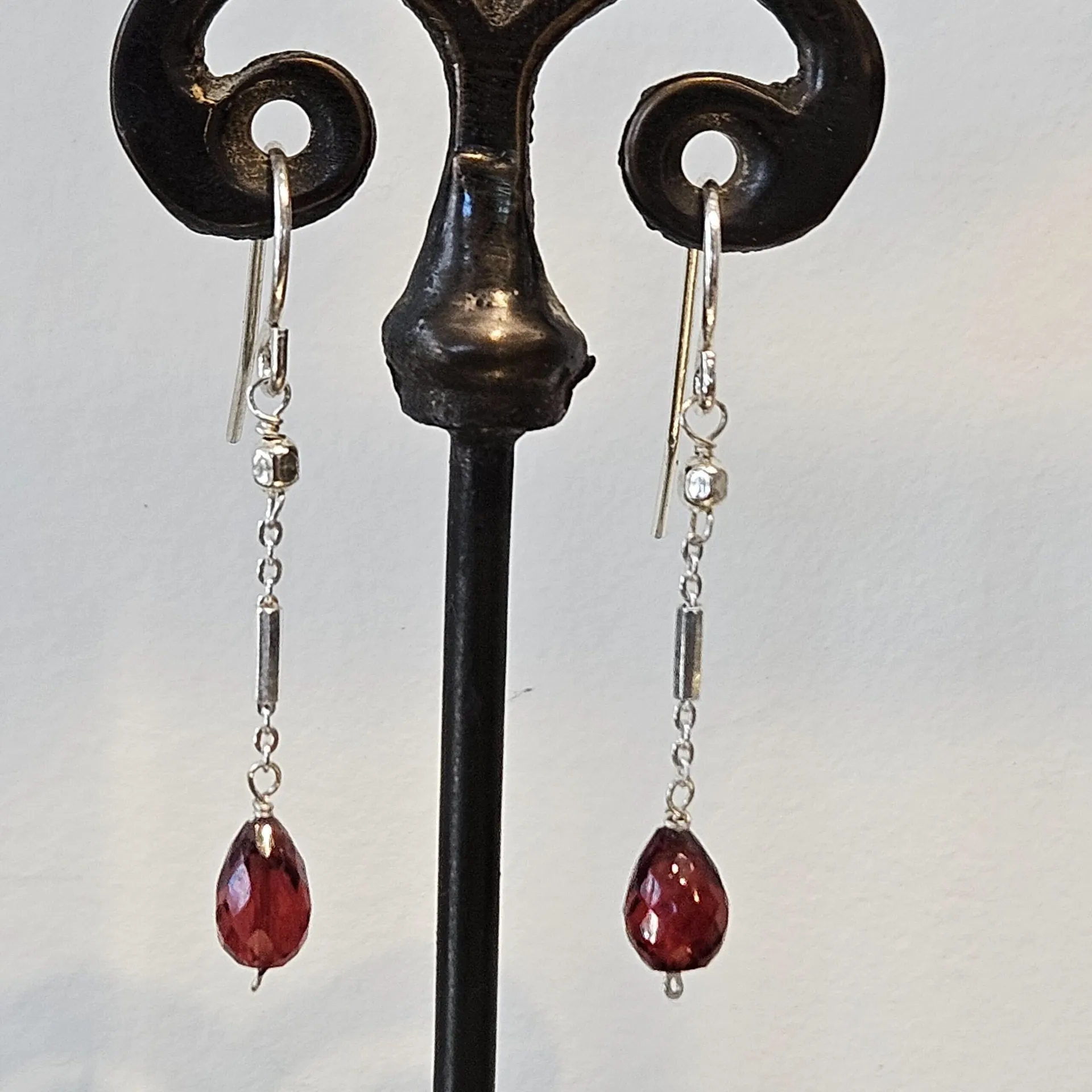 Faceted garnet teardrop earrings on sterling silver chain drops