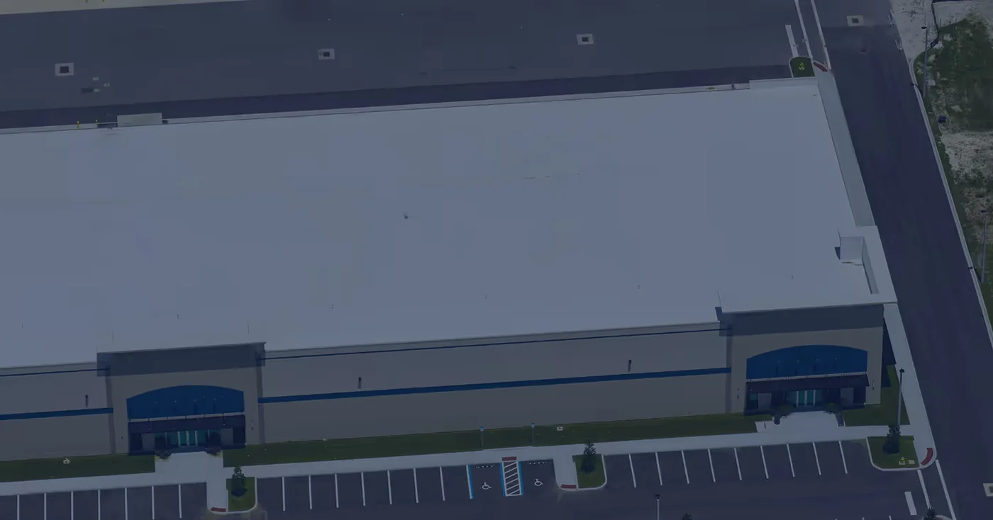 A drone view of a finished commercial warehouse roof