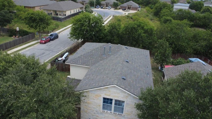 Aerial view of the finished shingle roof on Julia D.'s Austin home