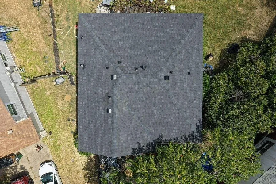 Drone view straight down onto the new dark shingle roof