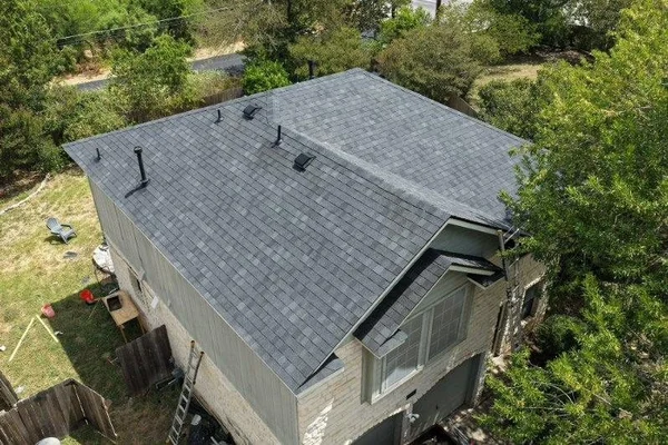 Aerial view of the finished roof on Kelly A.'s two-story home