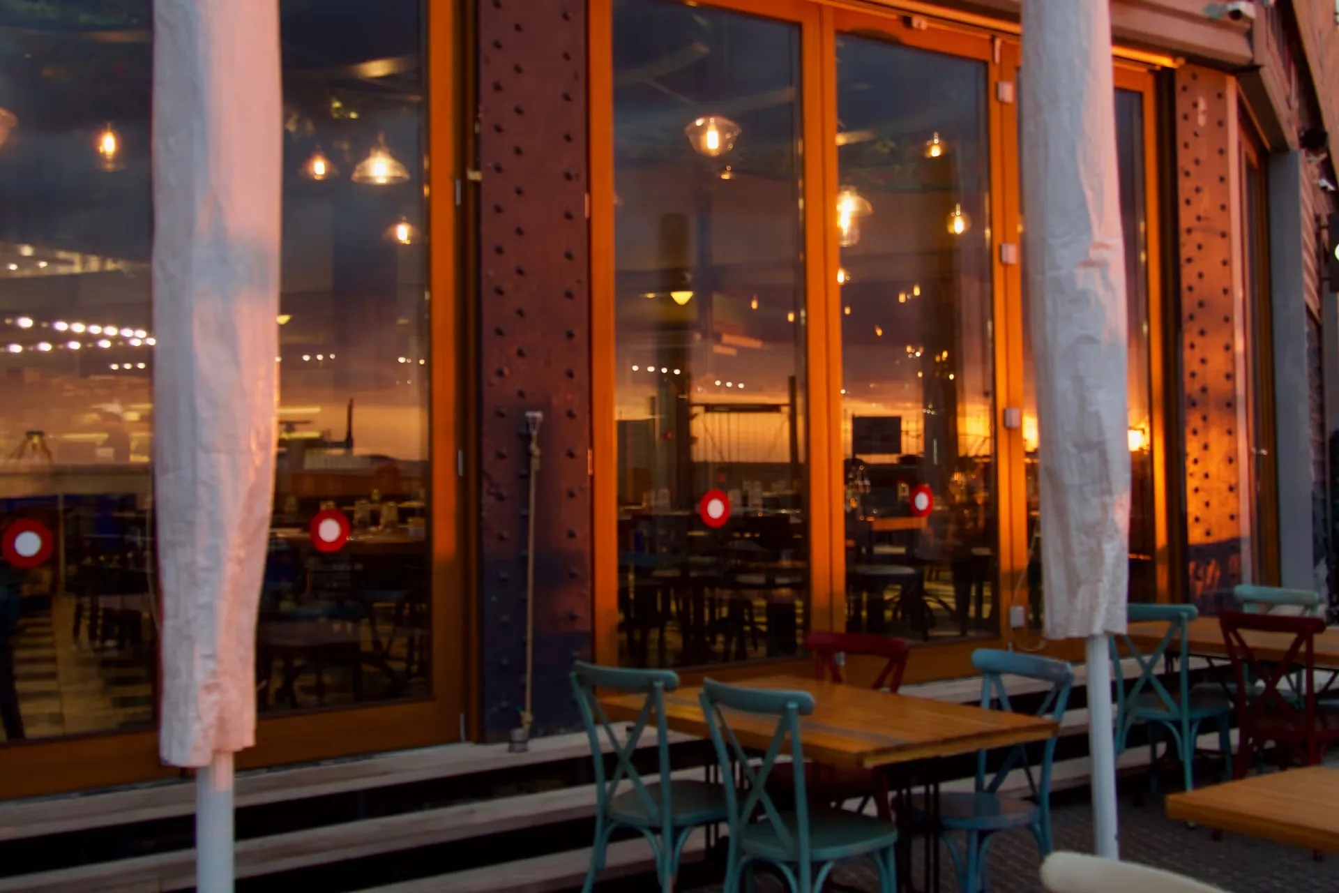 modern restaurant with large windows at dusk