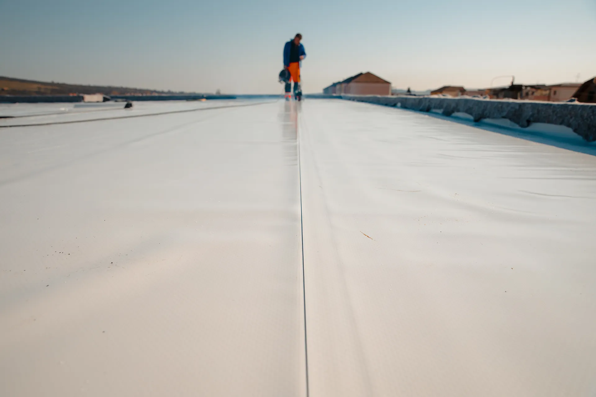 waterproofing roof application at a construction site