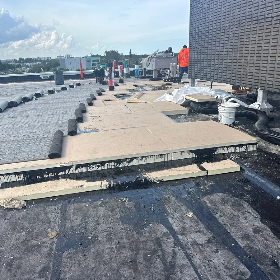 workers performing a commercial roof recover