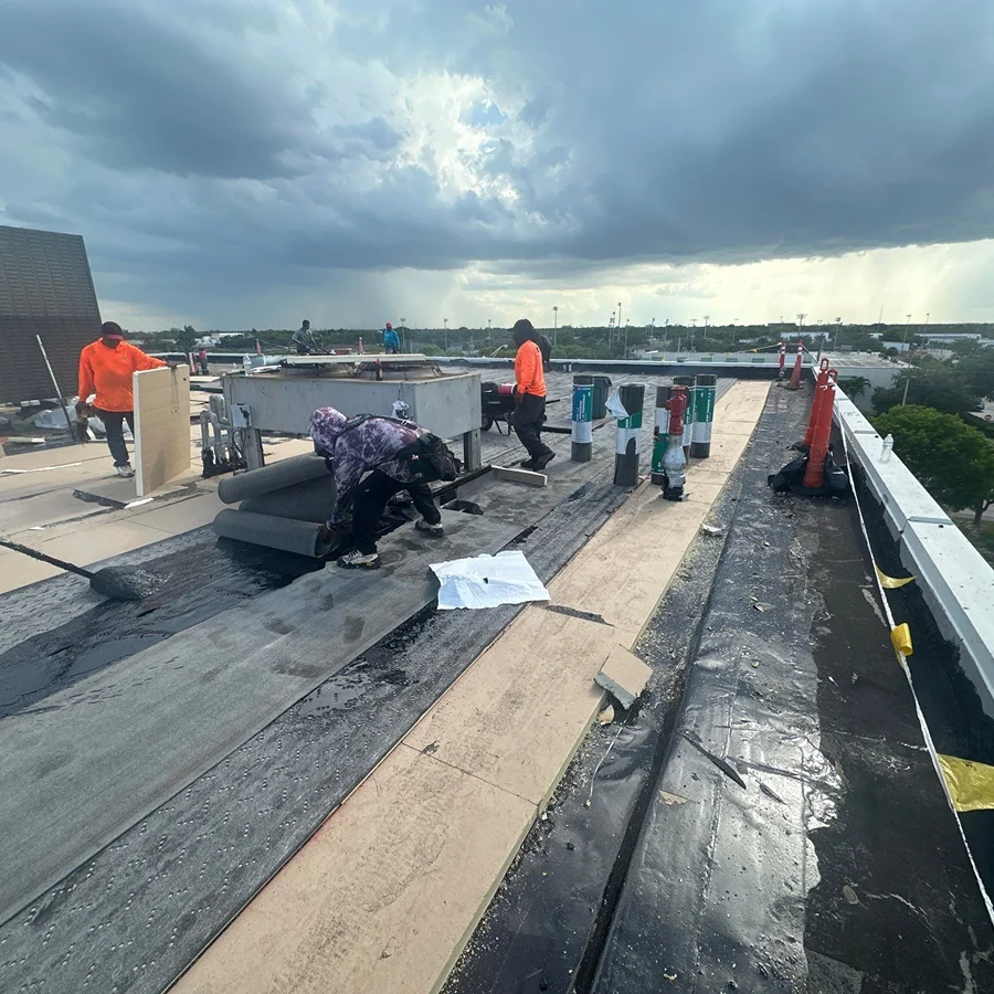 workers performing a commercial roof recover