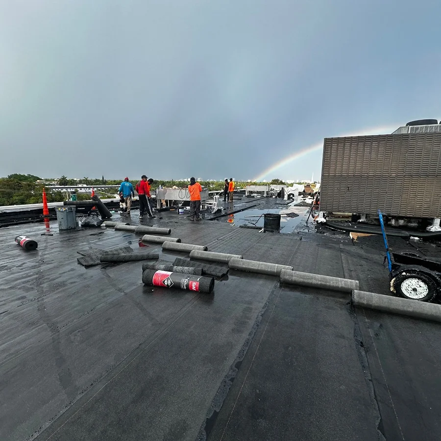 workers performing a commercial roof recover