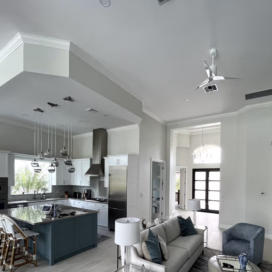 A freshly painted residential kitchen and living room